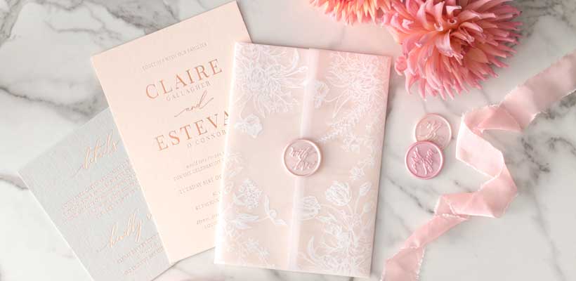 Various pink and white  wedding invitations by Giant Invitation. 