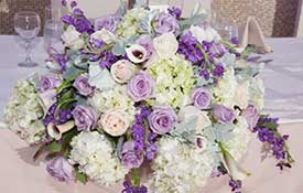 Purple and white flower table centerpiece.