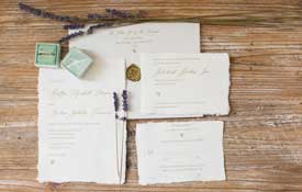 Ivory wedding invitation suite.