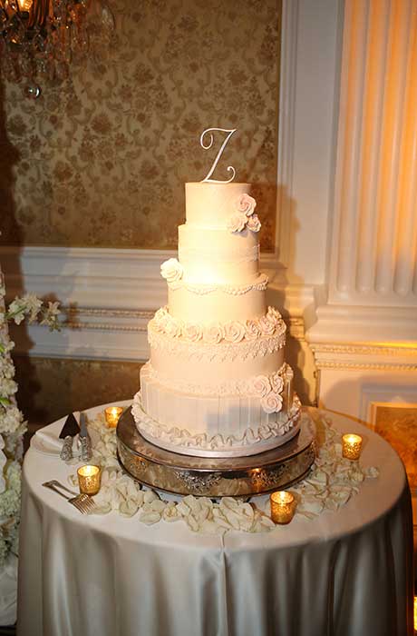 Five tier white wedding cake.