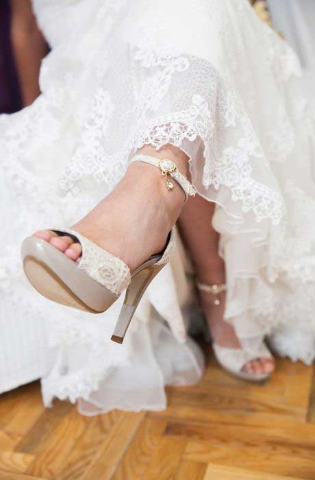 Wedding shoe on brides foot.