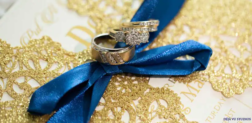 Wedding bands on a blue ribbon.  