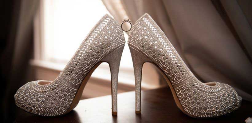 Tony Lante Photography gem wedding shoes holding ring  photo. 