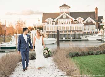 Couple walking on the grounds of the Peconic Bay Yacht Club.