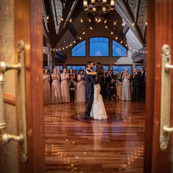 Bride and groom dancing on the dance floor in the ballroom. 
